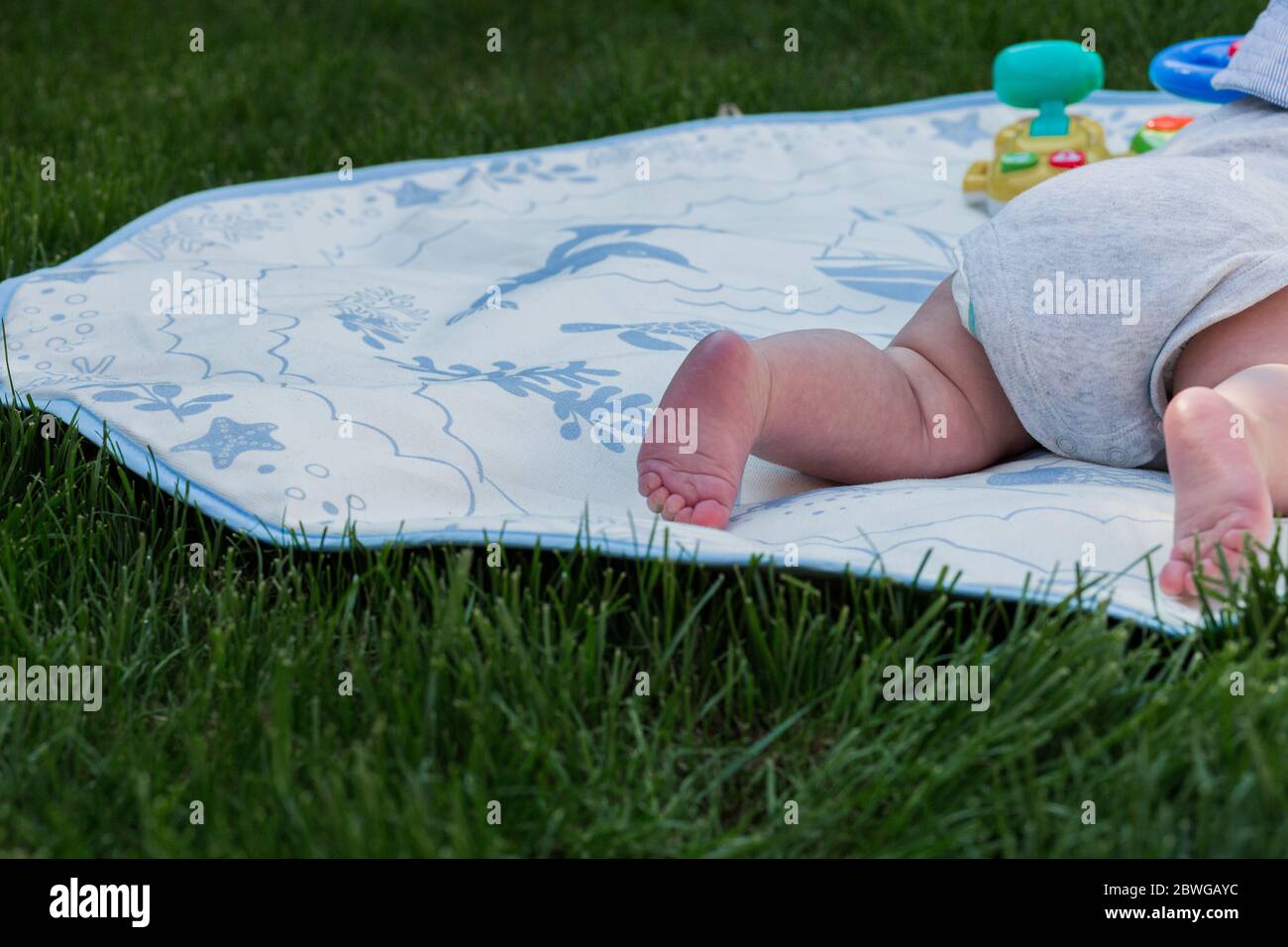Baby boy on playmat Stock Photo Alamy