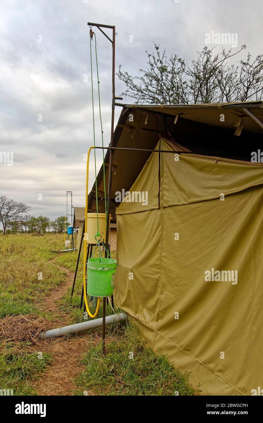 mobile tent camp, pulley system, shower water, buckets, behind tents