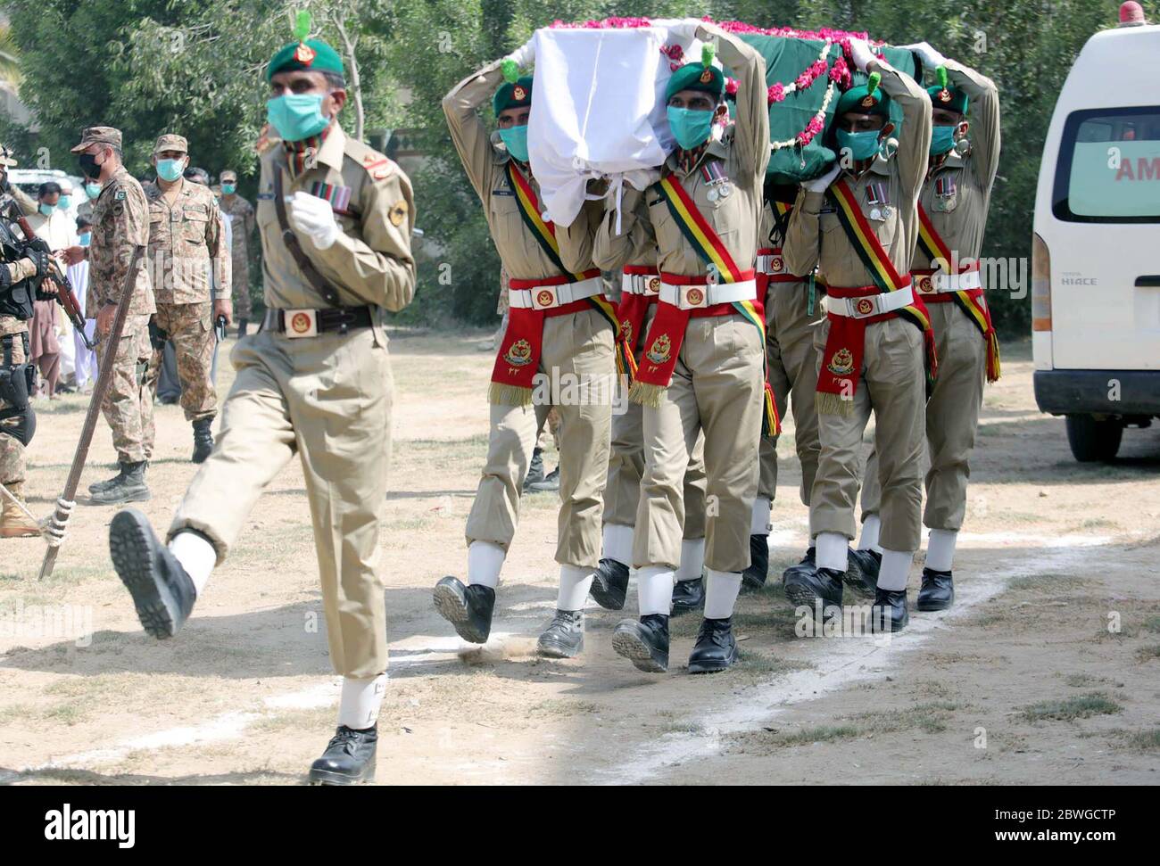 Pakistan Army officers attend funeral prayer of an army soldier Lieutenant Hamza Yousaf with full military honour, who was embraced martyrdom in the tragic PIA airplane crash incident, is being offered in Karachi on Monday, June 1, 2020. At least 97 bodies were recovered from the debris of the Pakistan International Airlines (PIA) aircraft flying from Lahore to Karachi that crashed in the densely populated area of Model Colony on Friday May 22. Stock Photo