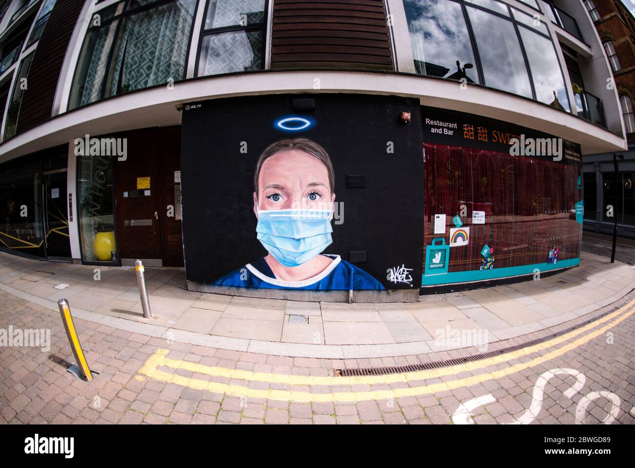 Mural featuring Manchester Royal Infirmary nurse Debra Williams as an angel by AKSE p19. Manchester, United Kingdom. Stock Photo