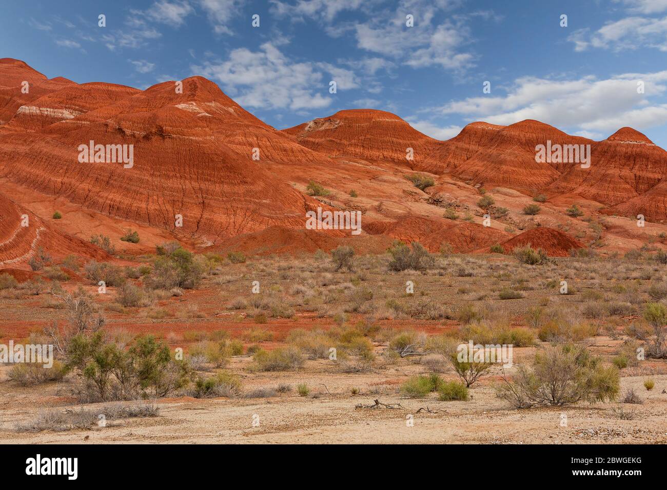 Extreme terrain and red geological formations in the Aktau Mountains area known also as White Mountains, in Kazakhstan Stock Photo