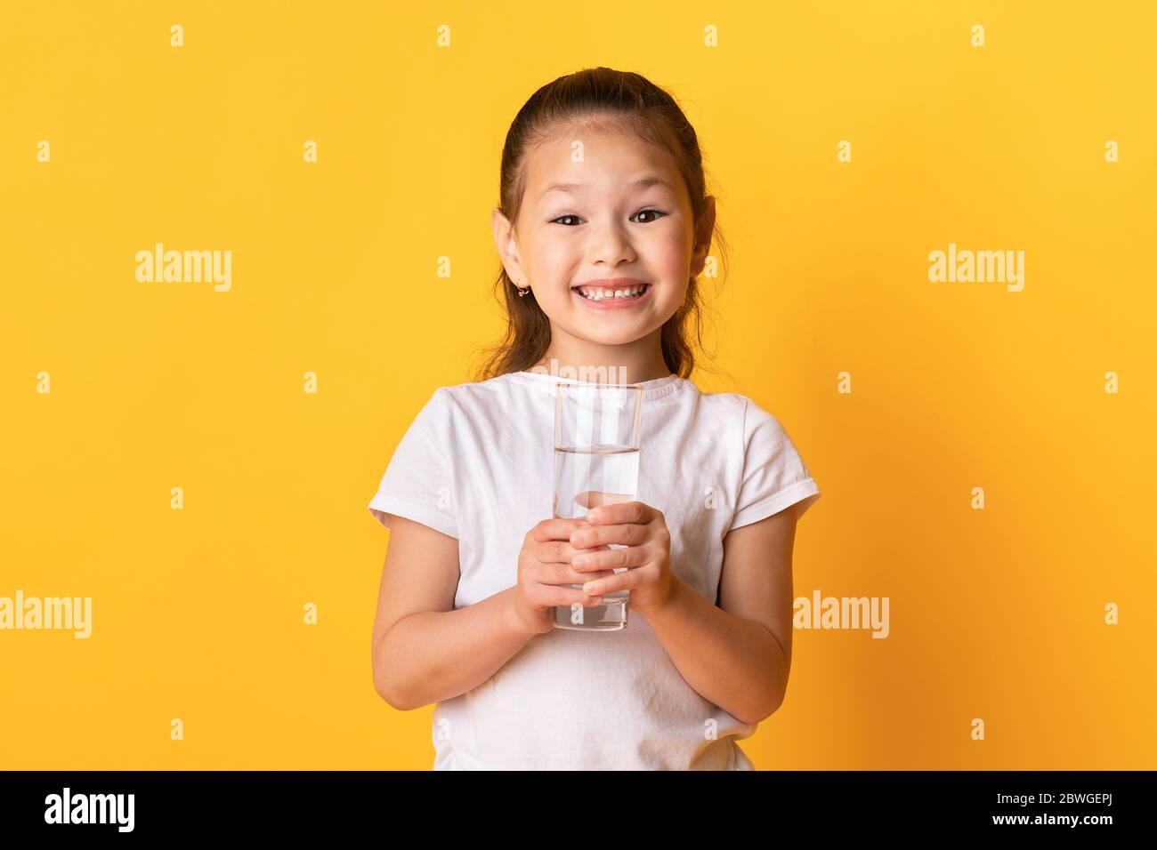 Funny child with a big water bottle Stock Photo by ©Gelpi 9436178