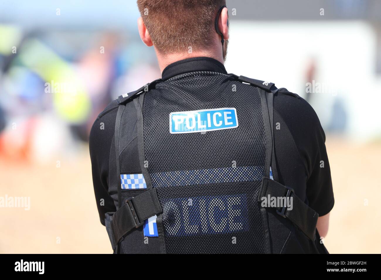 Hampshire Police officer on petrol on a beach in the UK Stock Photo
