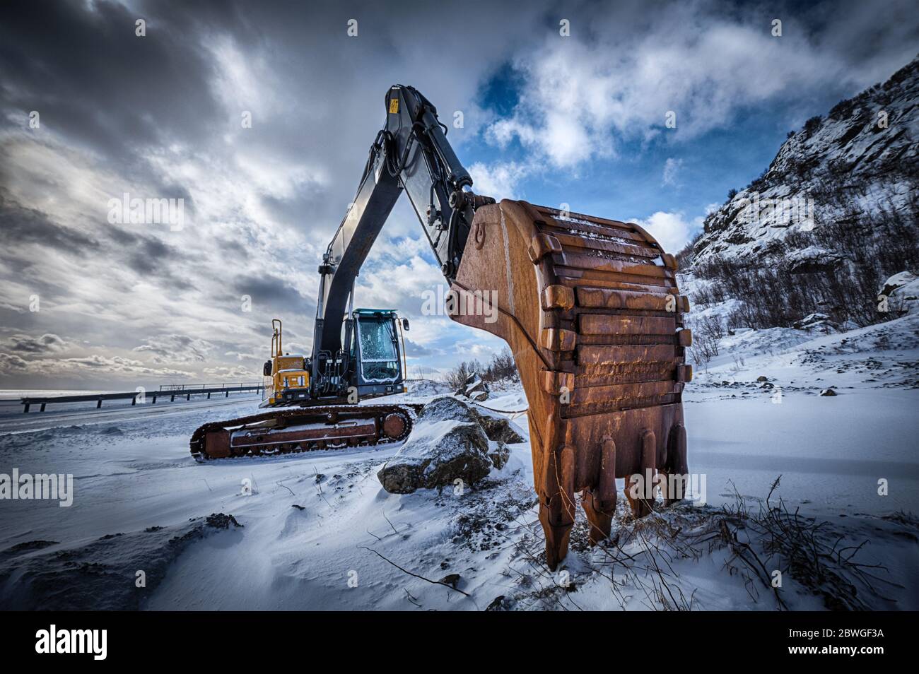 Old excavator in winter Stock Photo