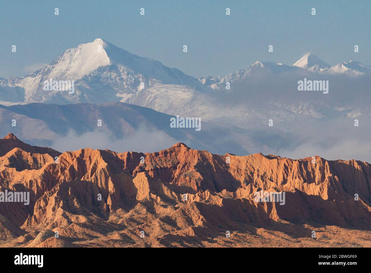 Snow capped mountains and geological formations in the Issyk Kul Lake area, Kyrgyzstan Stock Photo