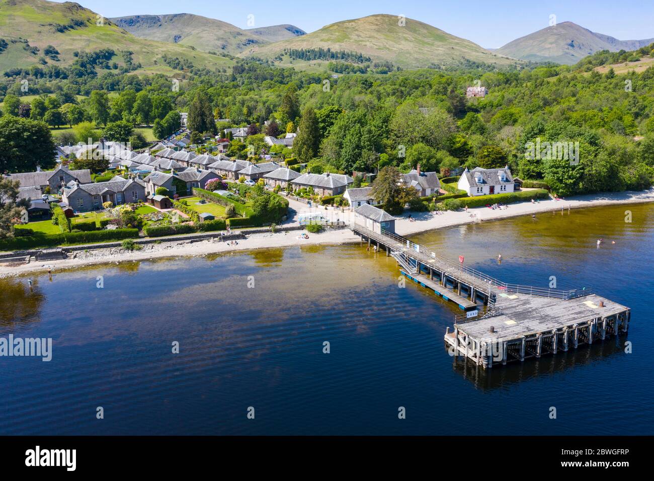 Aerial view of popular tourist village of Luss beside Loch Lomond in Argyll and Bute, Scotland, UK Stock Photo