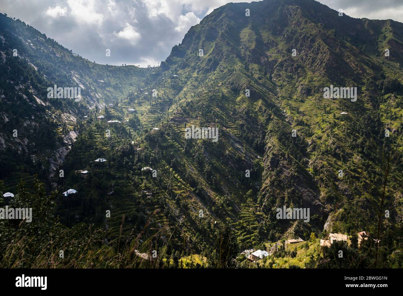Awesome, Local houses and steep terraced field at cliff, Elum Mountain trekking, Swat, Khyber Pakhtunkhwa Province, Pakistan, South Asia, Asia Stock Photo