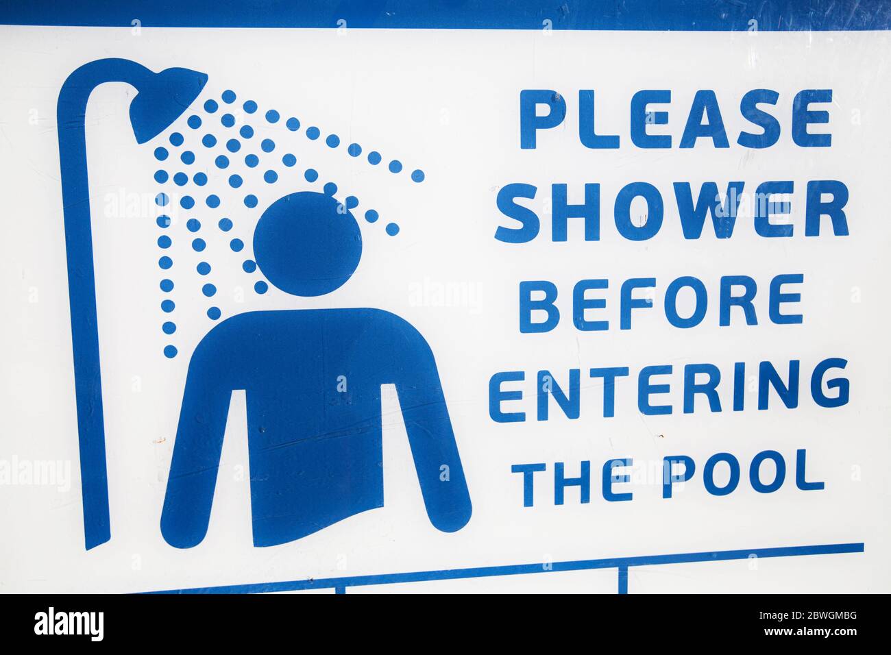 Shower before entering. Swimming pool sign Stock Photo Alamy