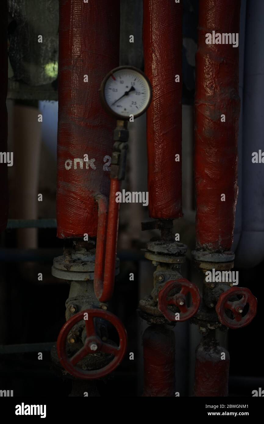 Old vintage steel steam boiler gauge in boiler house Stock Photo