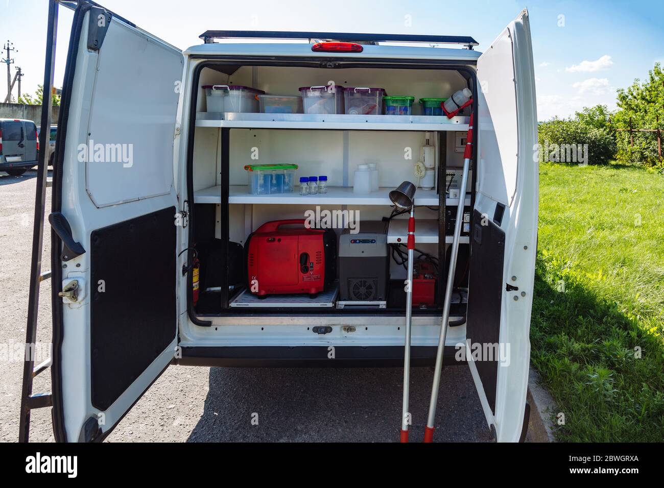 Mobile analytic laboratory in the minivan car, boxes for sampling Stock