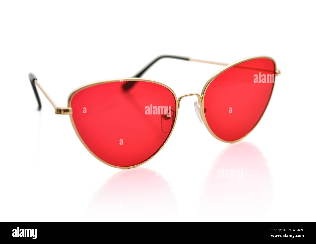 Sunglasses with metal frame, cat's eye shape, red lenses, isolated on white background with clipping path Stock Photo