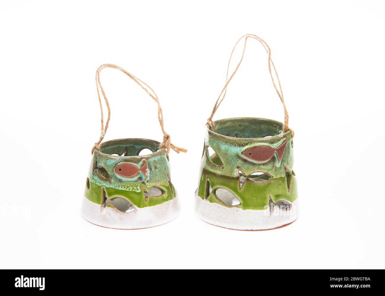 handmade ceramic candle holders with warm light Stock Photo Alamy