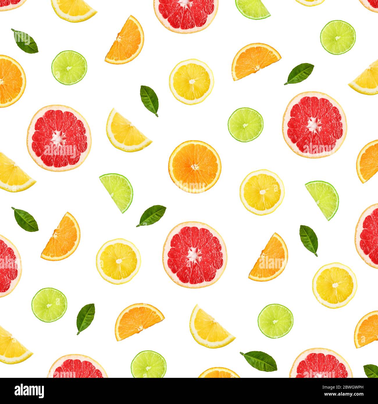 Colorful pattern of citrus fruit slices and citrus leaves isolated on ...