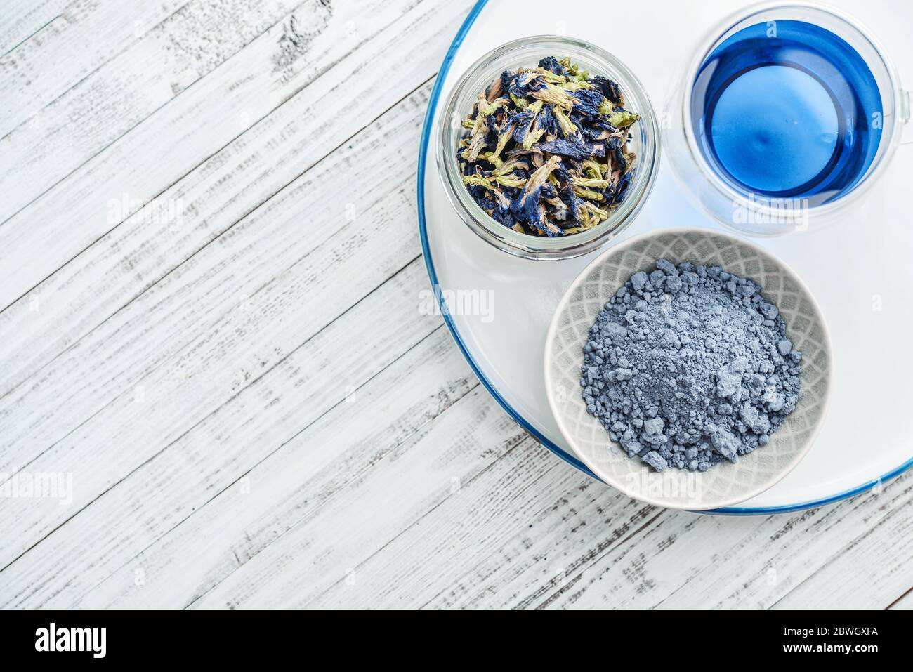 Organic blue tea Anchan, Clitoria, Butterfly Pea in glass with dried ...