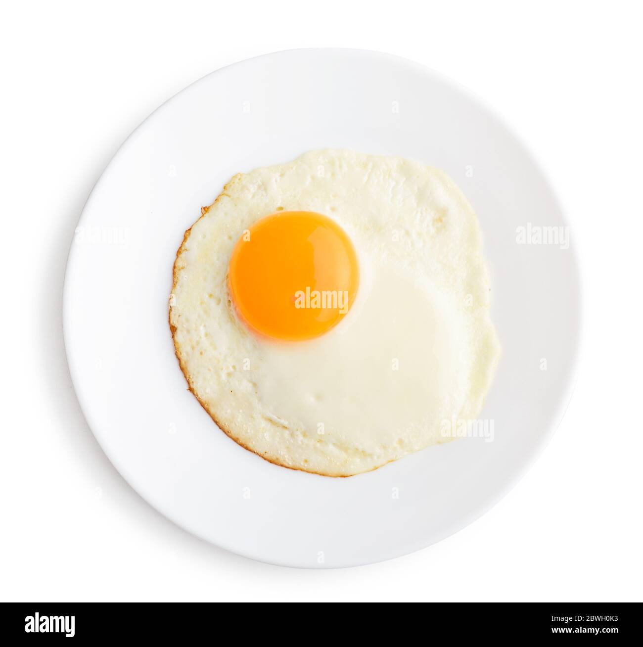 Fried egg on plate isolated on white background, top view Stock Photo ...