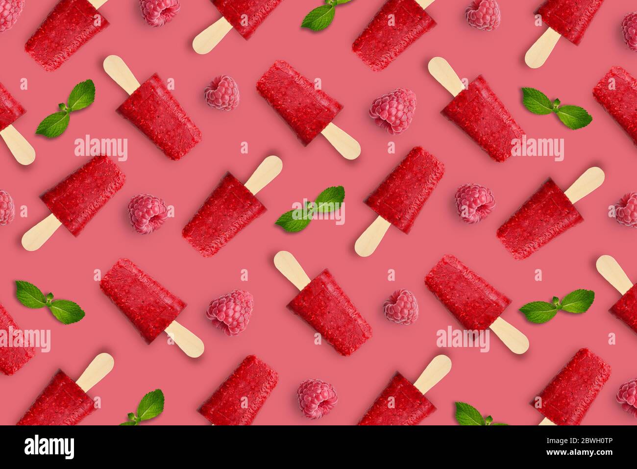 Pattern from raspberry popsicle on pink background Stock Photo