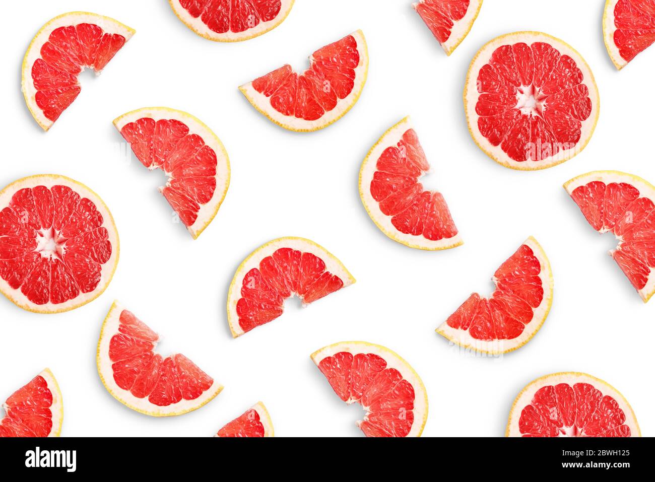 Grapefruit slices as pattern isolated on white background Stock Photo
