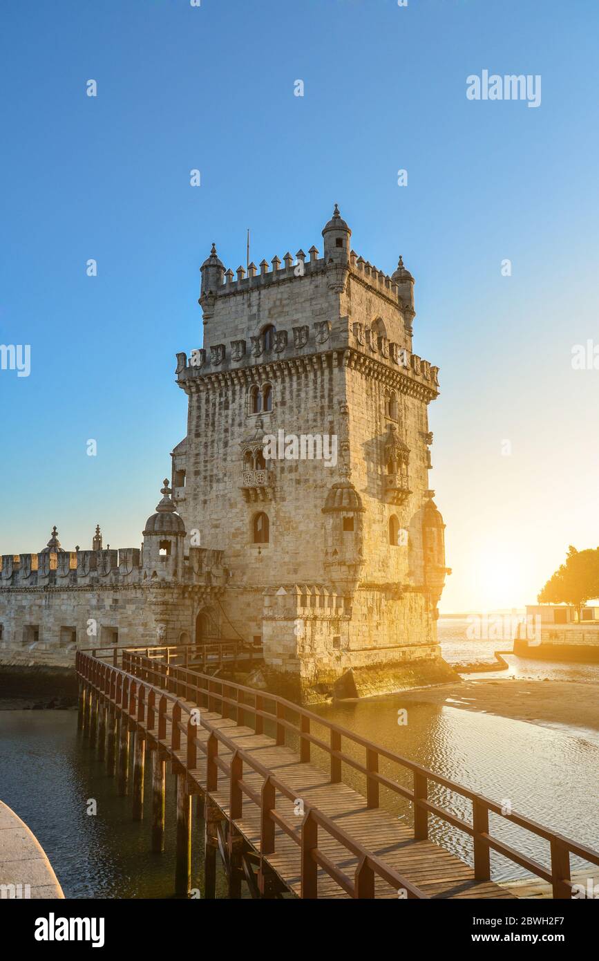 View at the Belem tower or Torre de Belem of Portuguese Manueline style on the northern bank of the Tagus River at sunset in Lisbon, Portugal Stock Photo