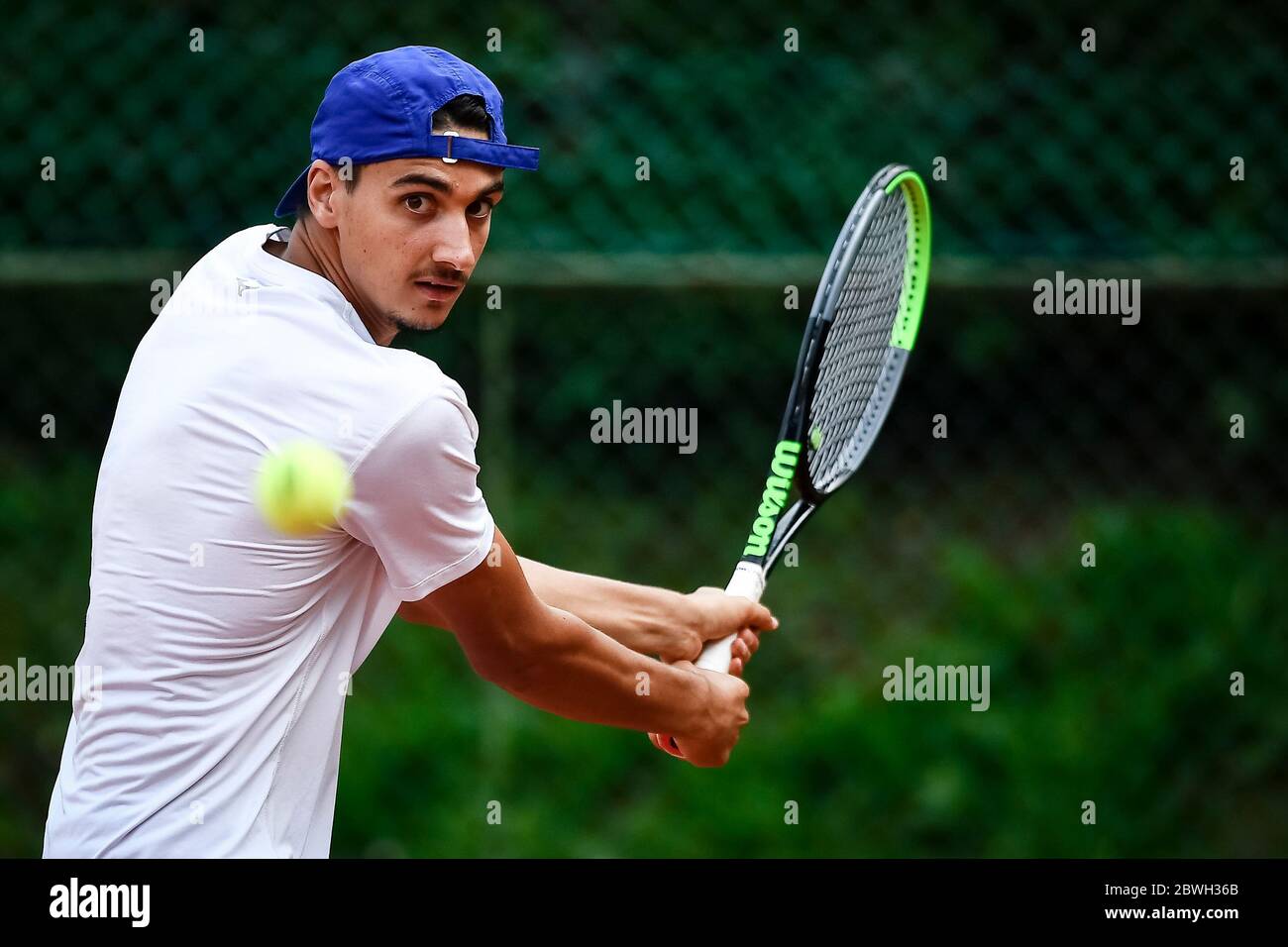 Turin, Italy - 01 June, 2020: Lorenzo Sonego, currently number 46 of ATP  ranking, plays a backhand during a tennis training. Athletes have started  training again after the lockdown caused by COVID-19