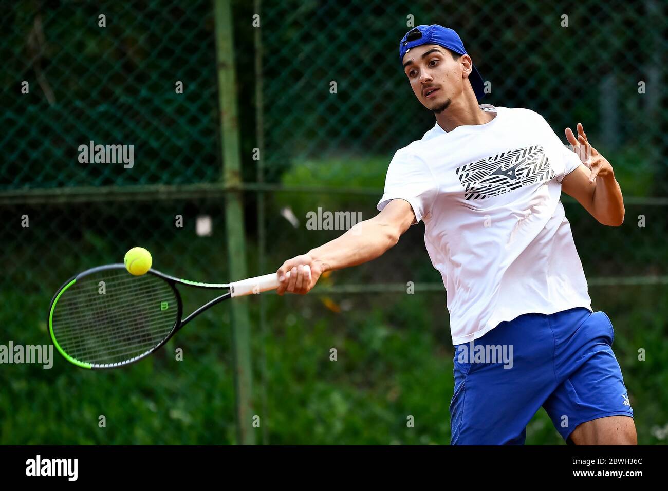 Turin, Italy - 01 June, 2020: Lorenzo Sonego, currently number 46 of ATP  ranking, plays a forehand during a tennis training. Athletes have started  training again after the lockdown caused by COVID-19