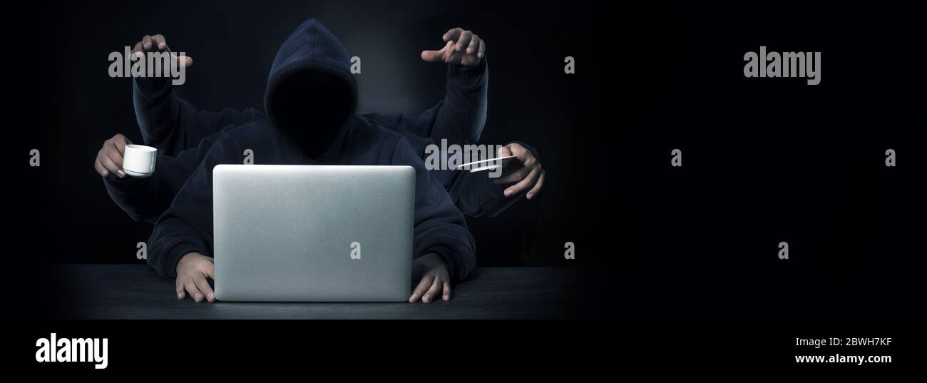 a programmer with six hands all a successful workaholic in the workplace Stock Photo