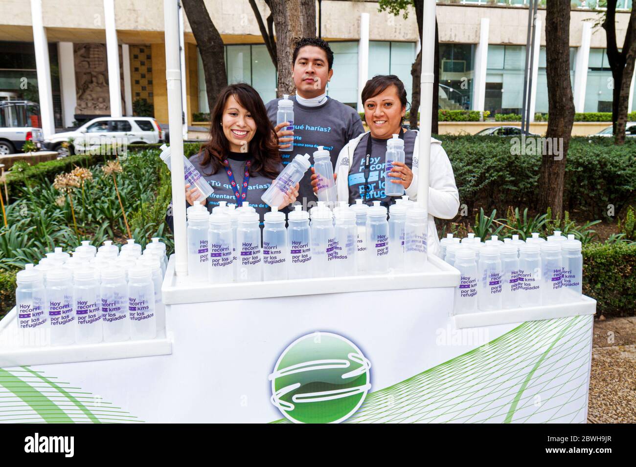 Mexico City,México,Mexican,Paseo de la Reforma,Cicloton,urban bicycling program,community refugee exhibit,promotional,water bottle,Hispanic ethnic man Stock Photo