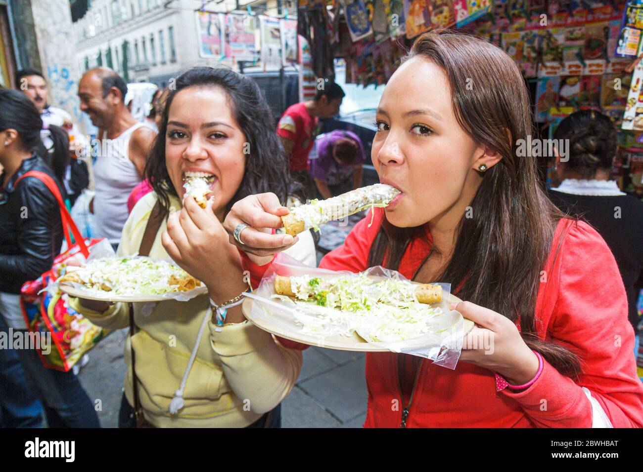 Mexico City,México Mexican,Cuauhtemoc,Centro historico,district,street food,flautas,typical food,plate,dish,Hispanic adult,adults,woman female women,e Stock Photo