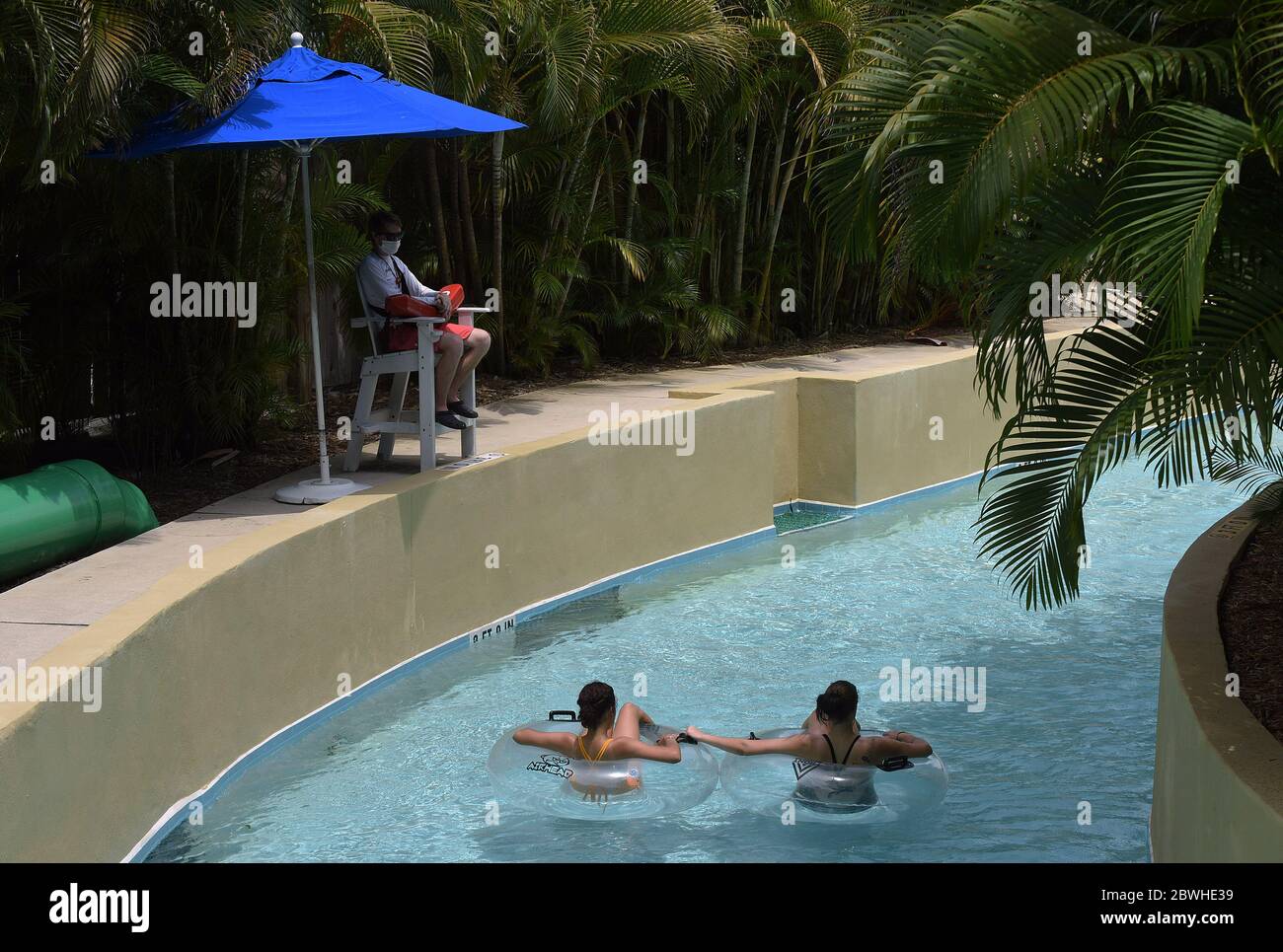 June 1, 2020 - Winter Haven, Florida, United States - Guests ride tubes on the lazy river at the LEGOLAND Florida Water Park on the day the theme park reopened to the public after closing in mid-March due to the coronavirus pandemic. Guests are now required to submit to temperature checks and the wearing of face coverings is recommended but not required. (Paul Hennessy/Alamy Live News) Stock Photo