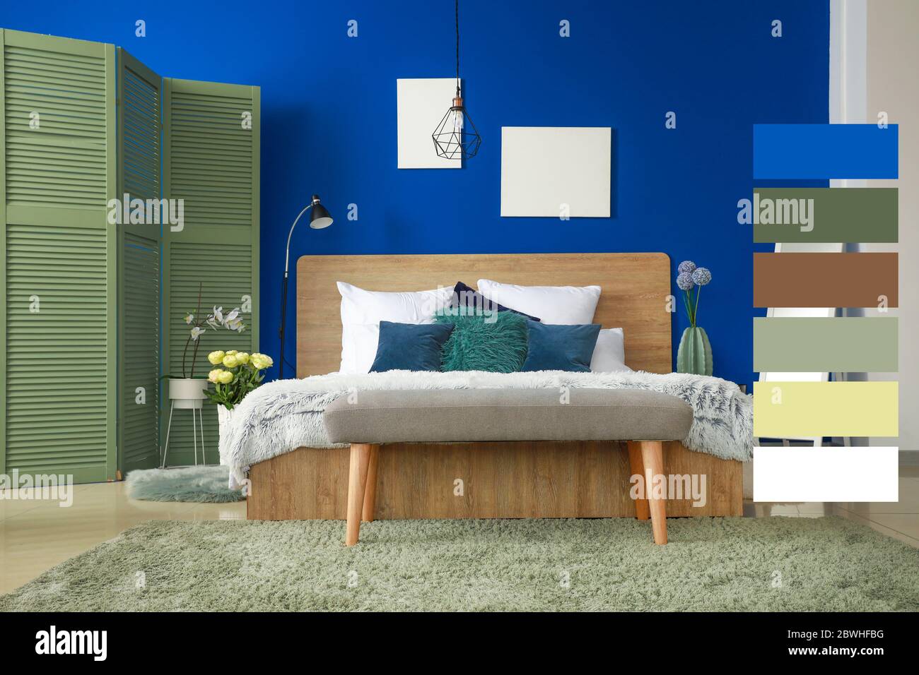 Interior of modern bedroom with blue wall. Different color patterns Stock  Photo - Alamy