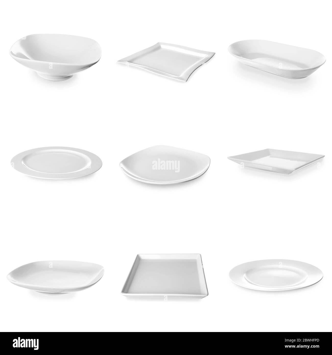 Set of empty ceramic plates on white background Stock Photo Alamy