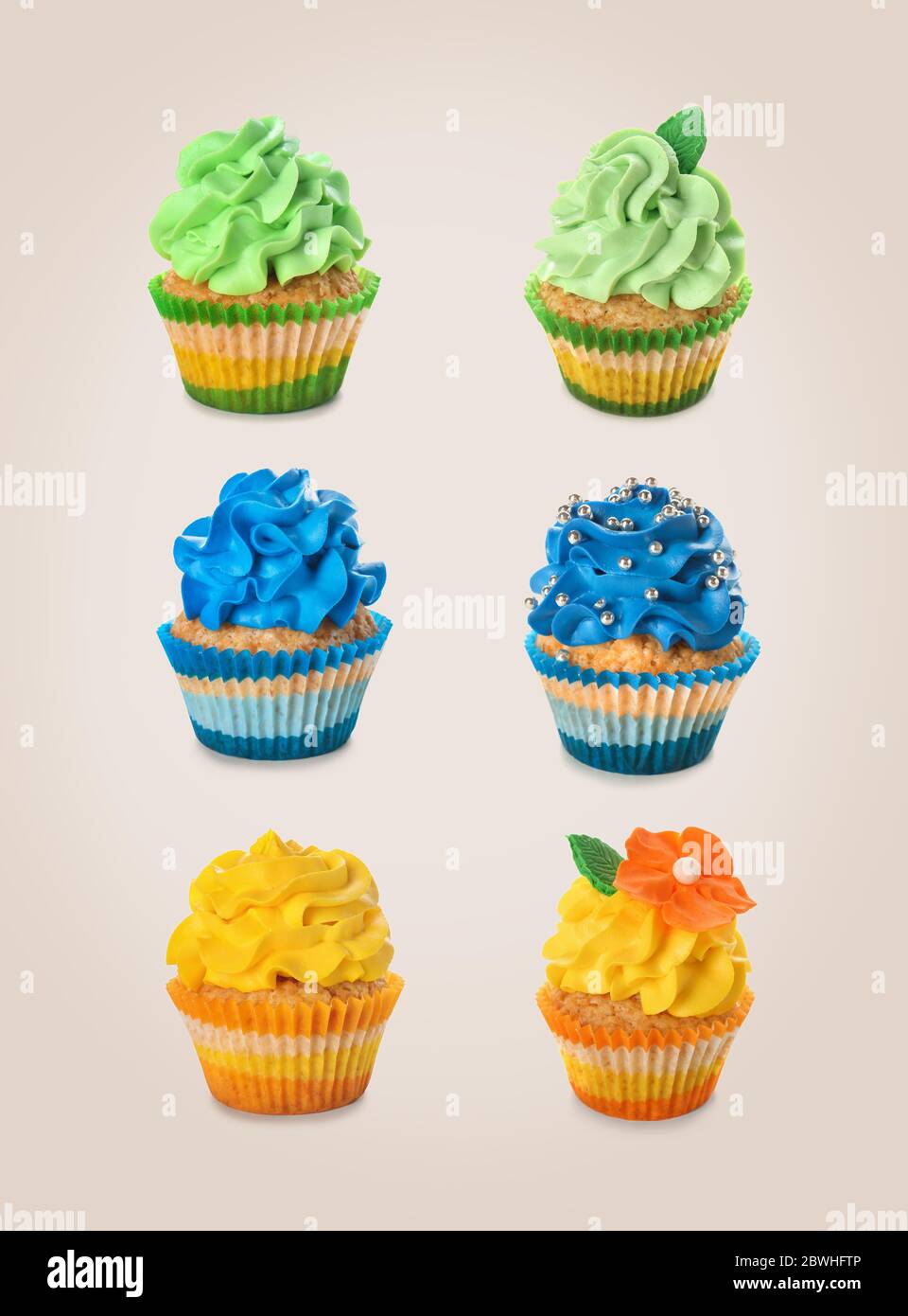 Colorful cupcakes on grey background Stock Photo