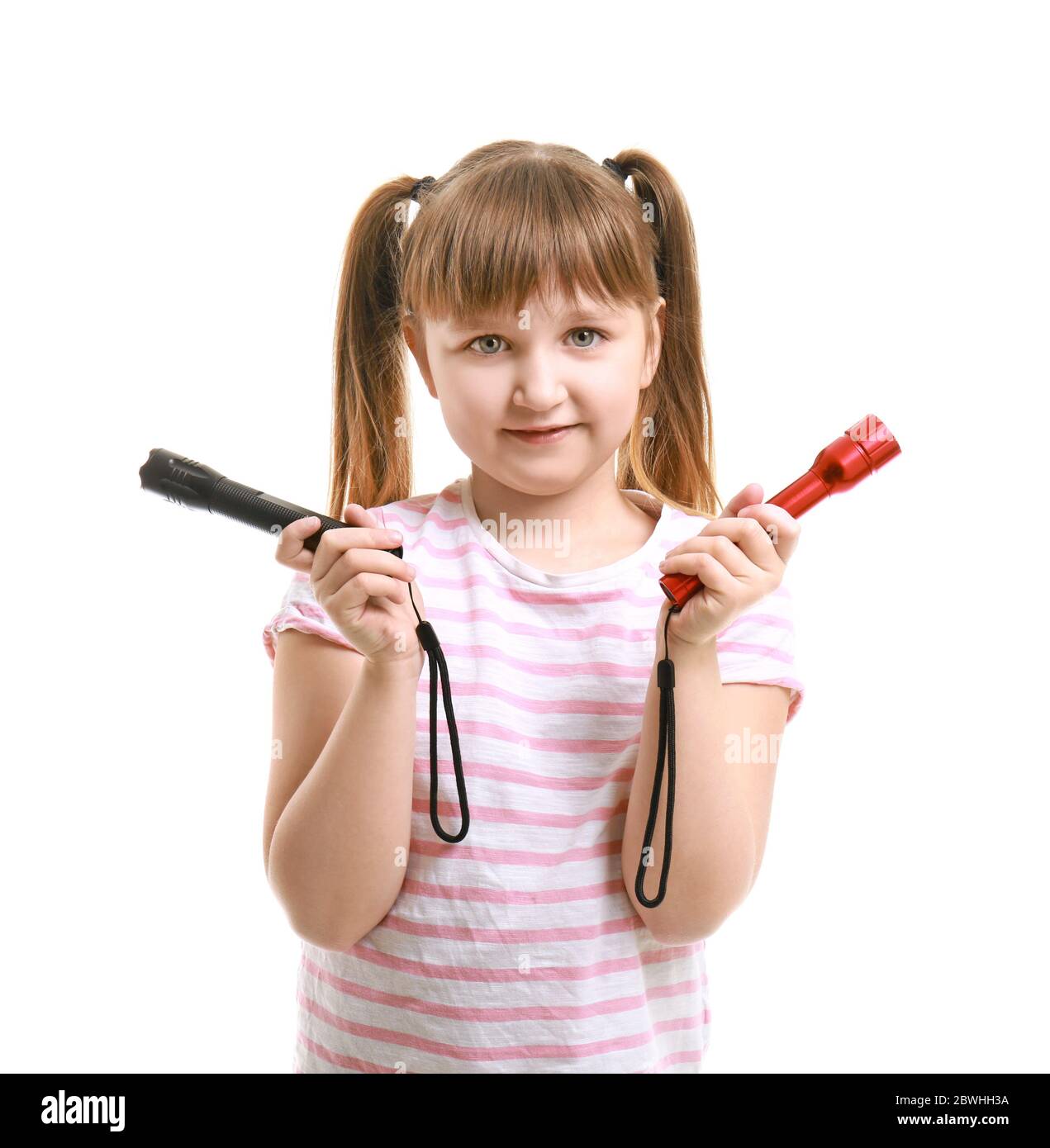 Little girl with flashlights on white background Stock Photo Alamy