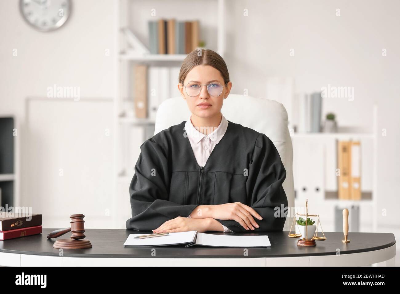 Female judge working at table in office Stock Photo