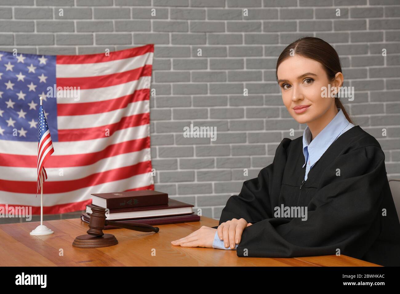 Female judge at table in courtroom Stock Photo - Alamy