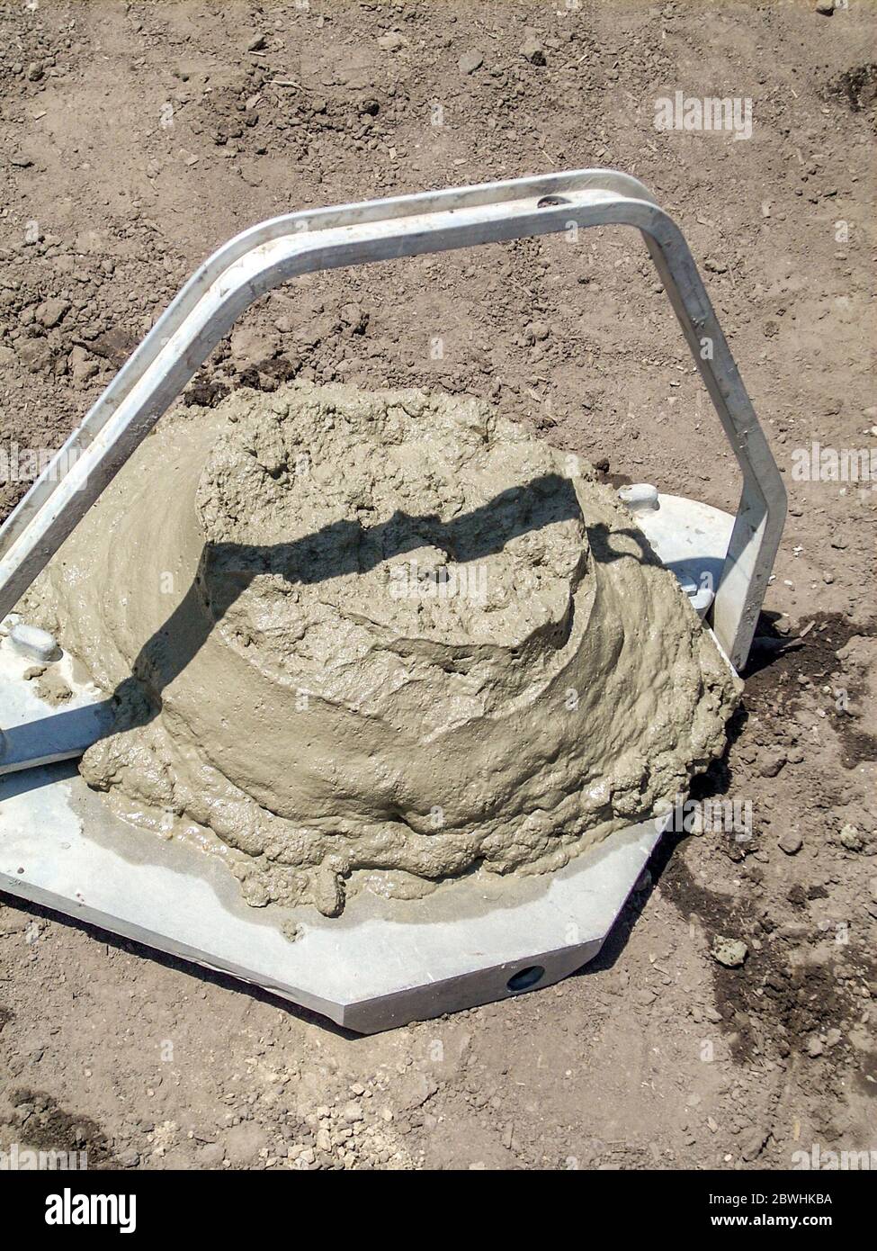 Engineering specification test for water and workability of concrete by measuring slump of a formed cone Stock Photo