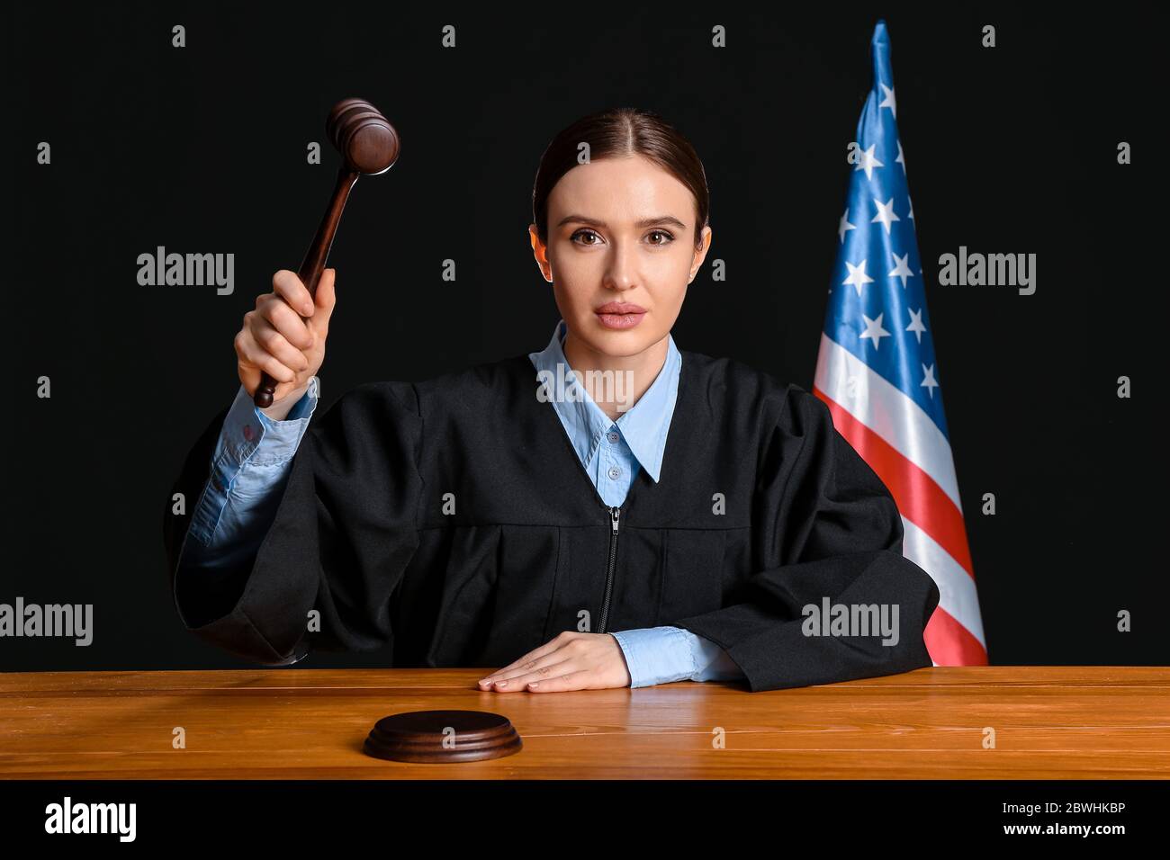 Female judge at table in courtroom Stock Photo - Alamy