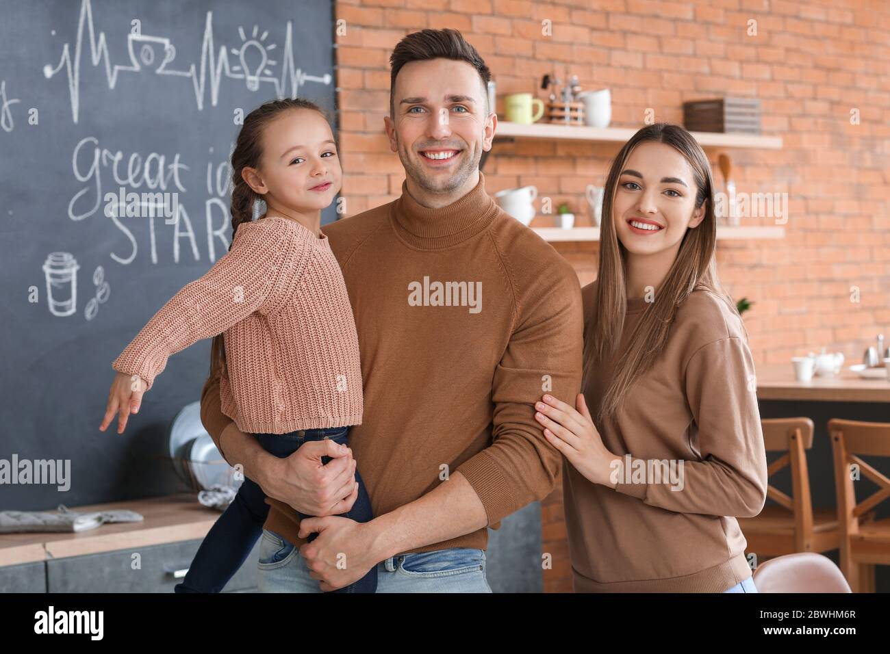 Happy family spending time together in kitchen Stock Photo