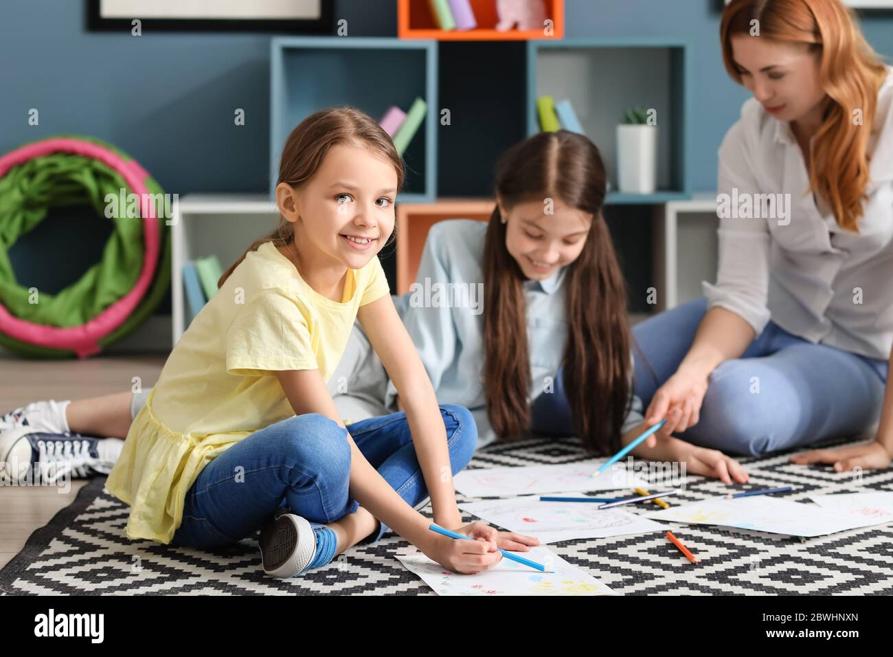 Cute children drawing at school Stock Photo - Alamy