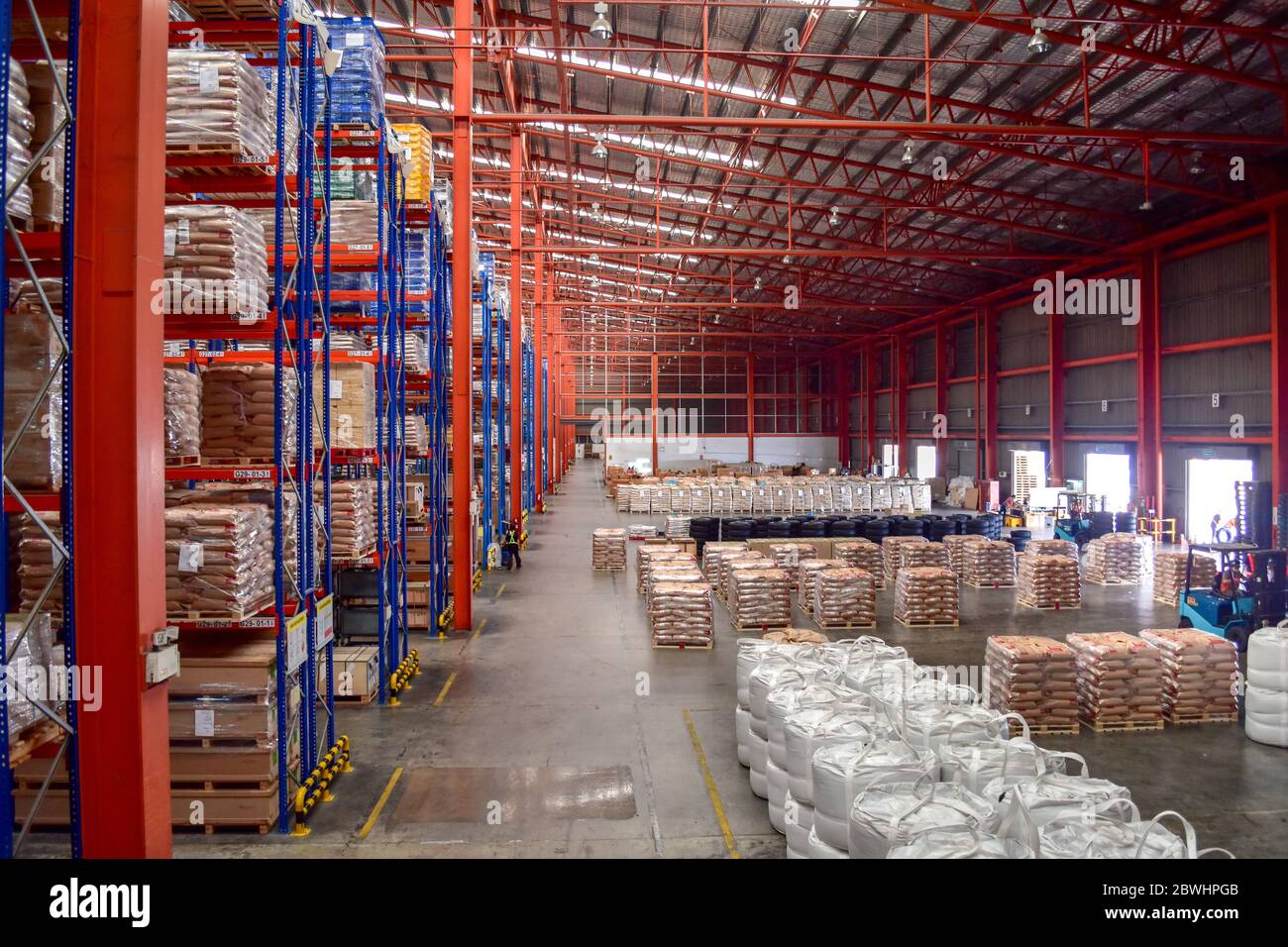 High view of cargo shorting area inside large distribution warehouse. Stock Photo