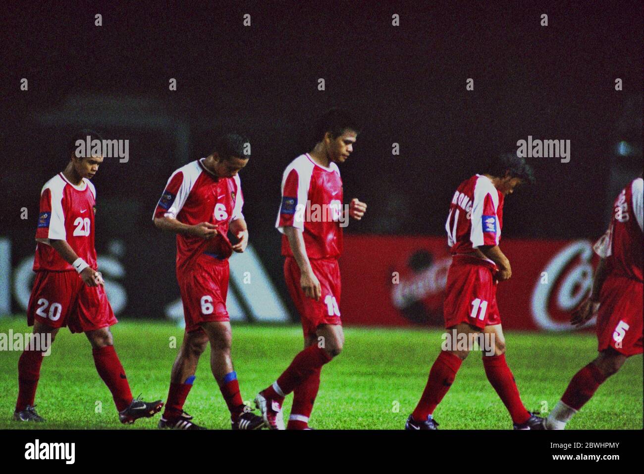 Players of Indonesia national football team walking in a row for half-time break during the 2002 Tiger Cup (2002 AFF Championship) group stage match against Vietnam in Gelora Bung Karno Stadium in Senayan, Jakarta, Indonesia. Archival photo. December 21st, 2002. Full-Time: Indonesia 2-2 Vietnam. Stock Photo