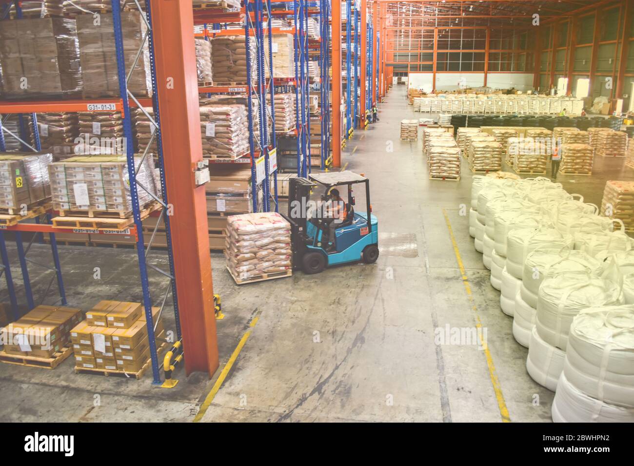 High view of cargo shorting area inside large distribution warehouse. Stock Photo