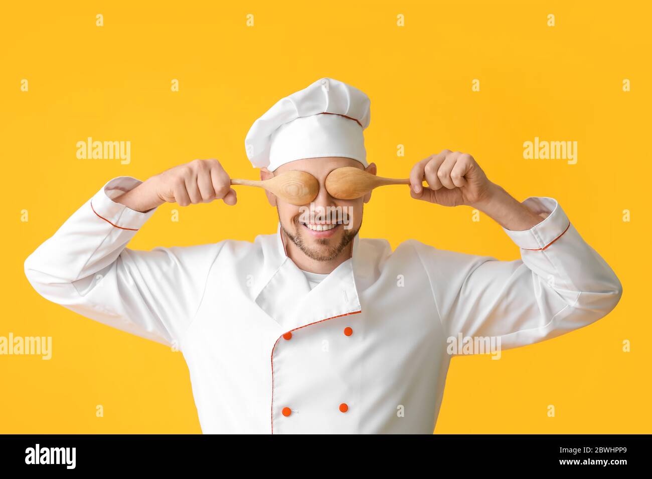 Portrait of male chef on color background Stock Photo - Alamy