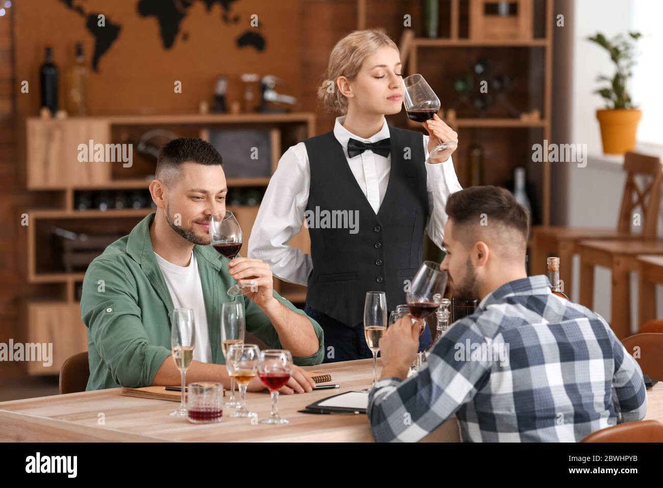 People tasting wine at the restaurant Stock Photo