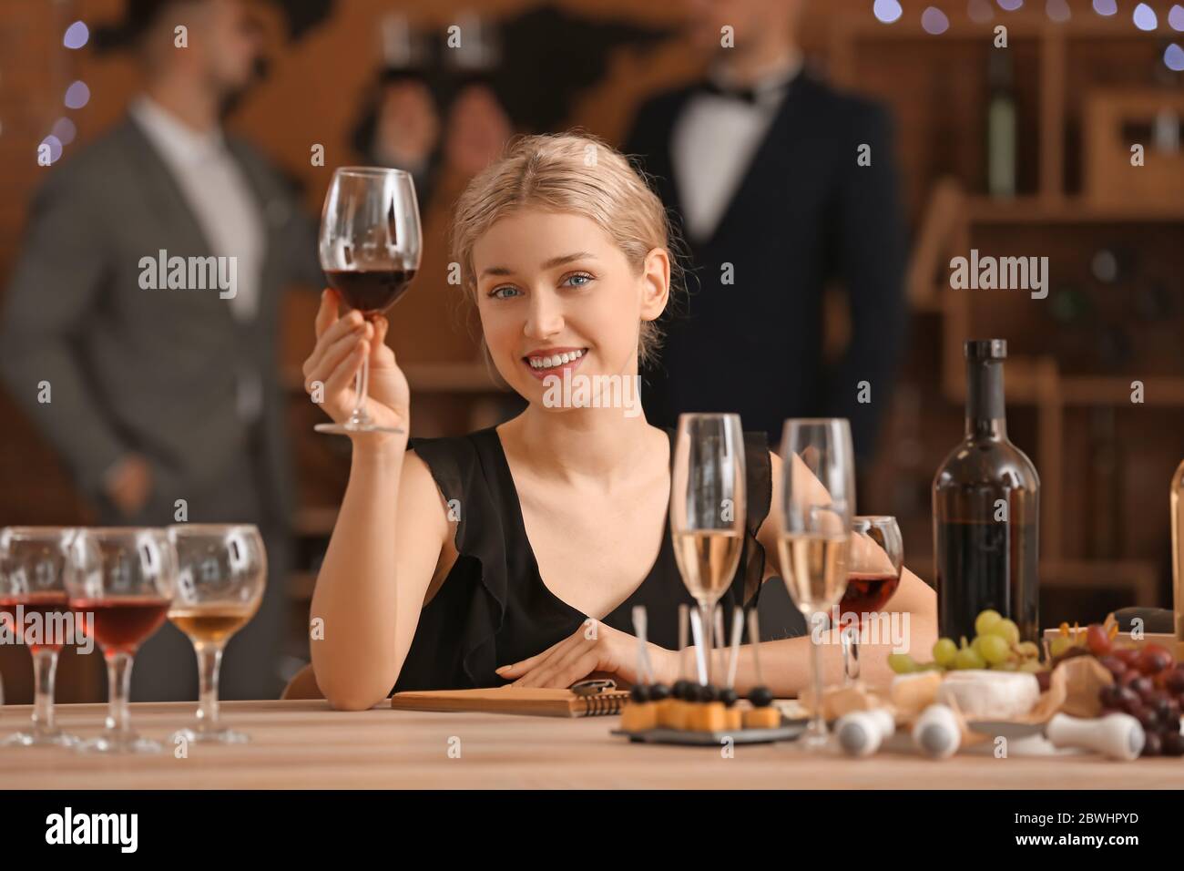 Woman tasting wine at the restaurant Stock Photo - Alamy