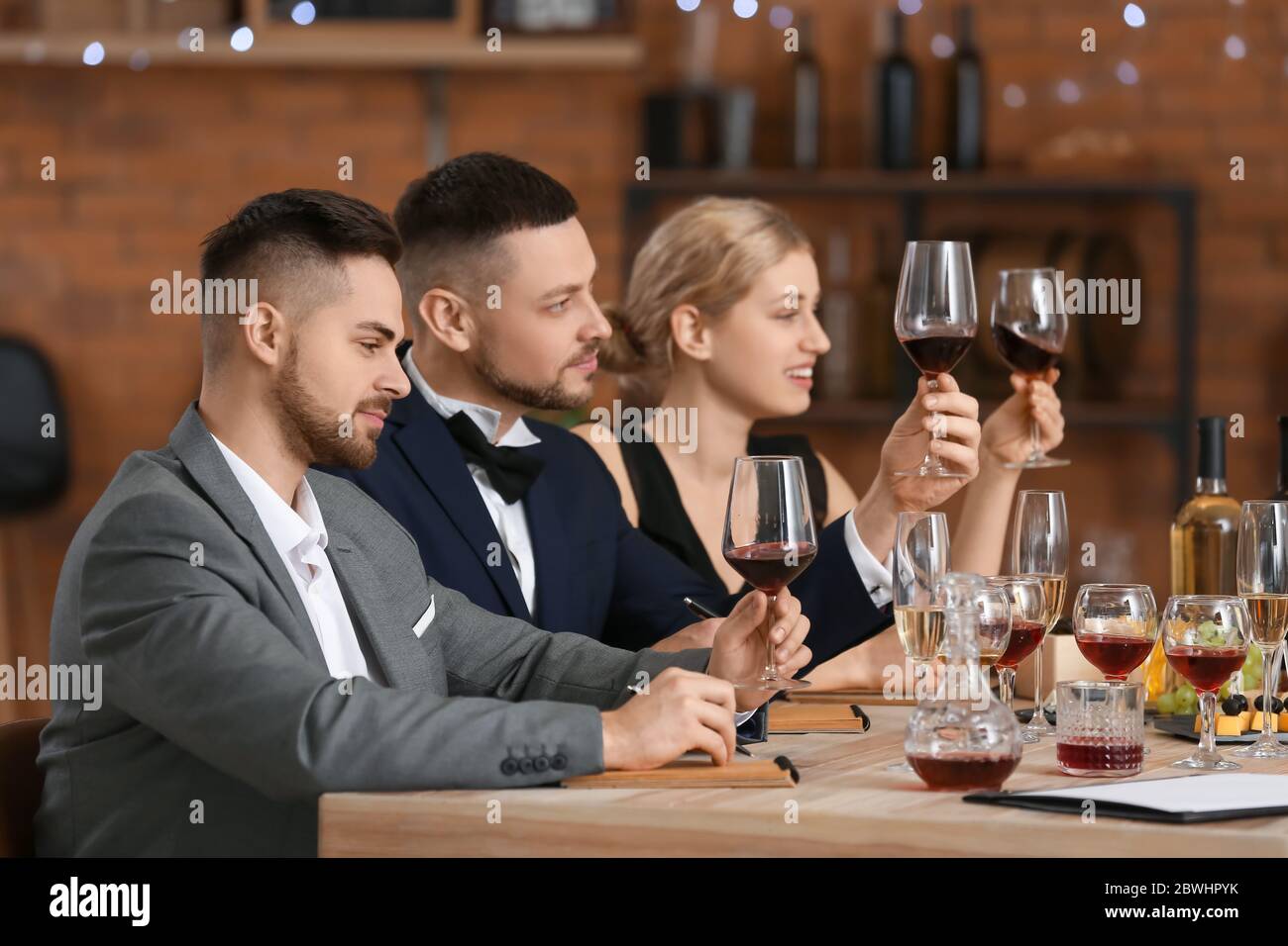 People tasting wine at the restaurant Stock Photo - Alamy