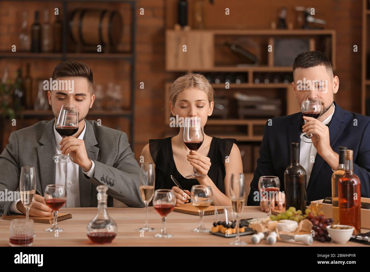 People tasting wine at the restaurant Stock Photo