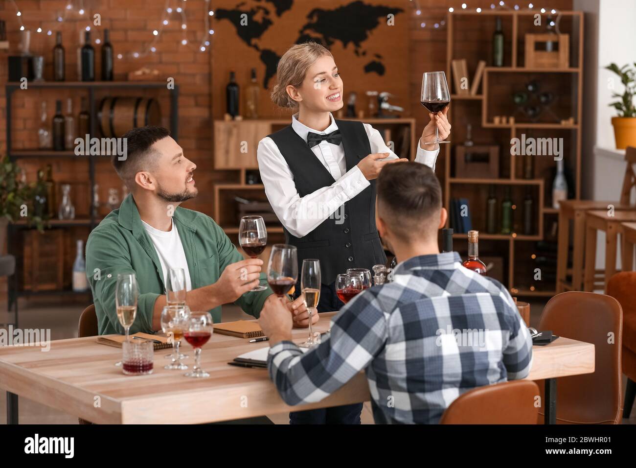 People tasting wine at the restaurant Stock Photo - Alamy