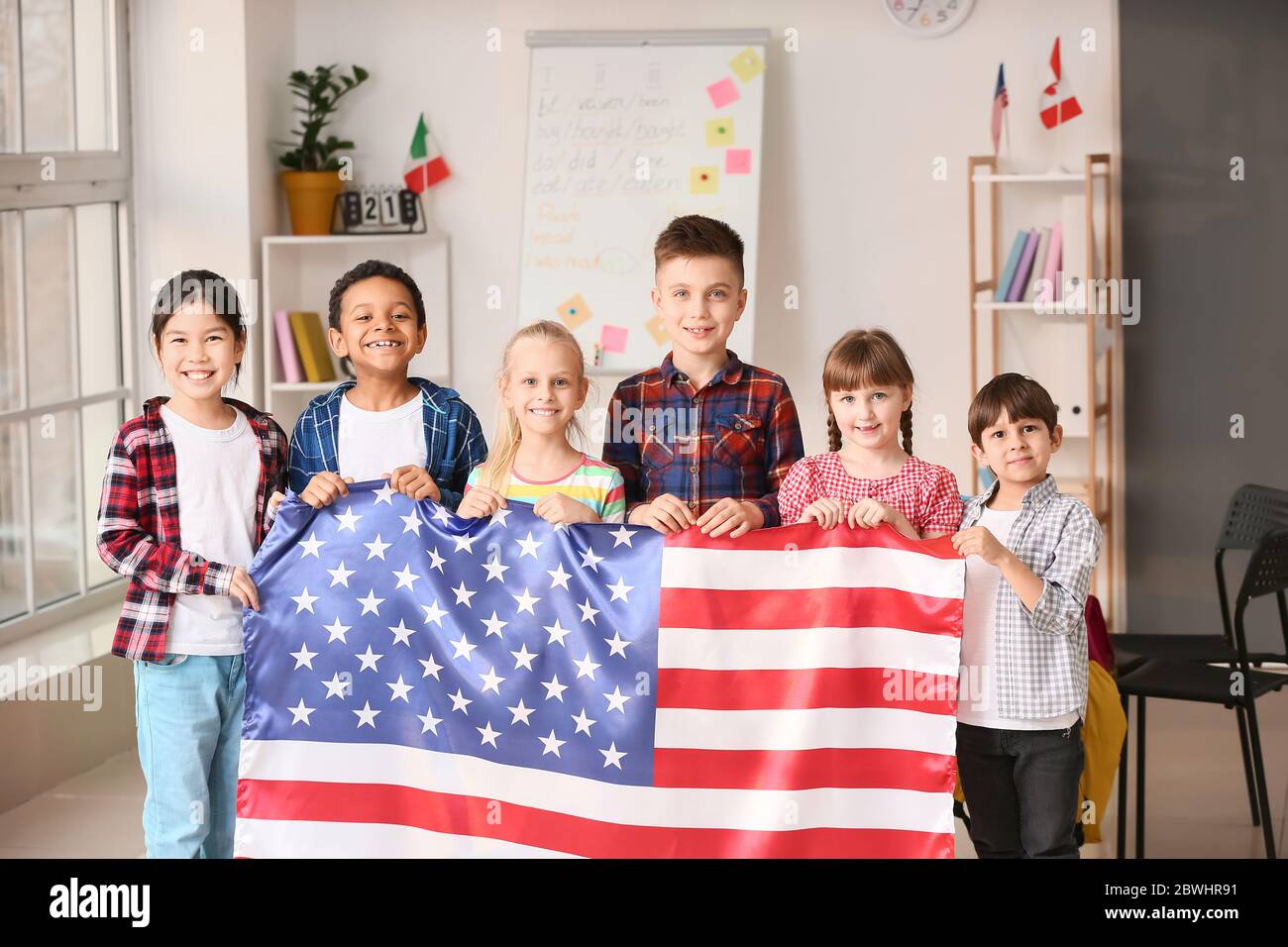 Little children with flag of USA at language school Stock Photo - Alamy