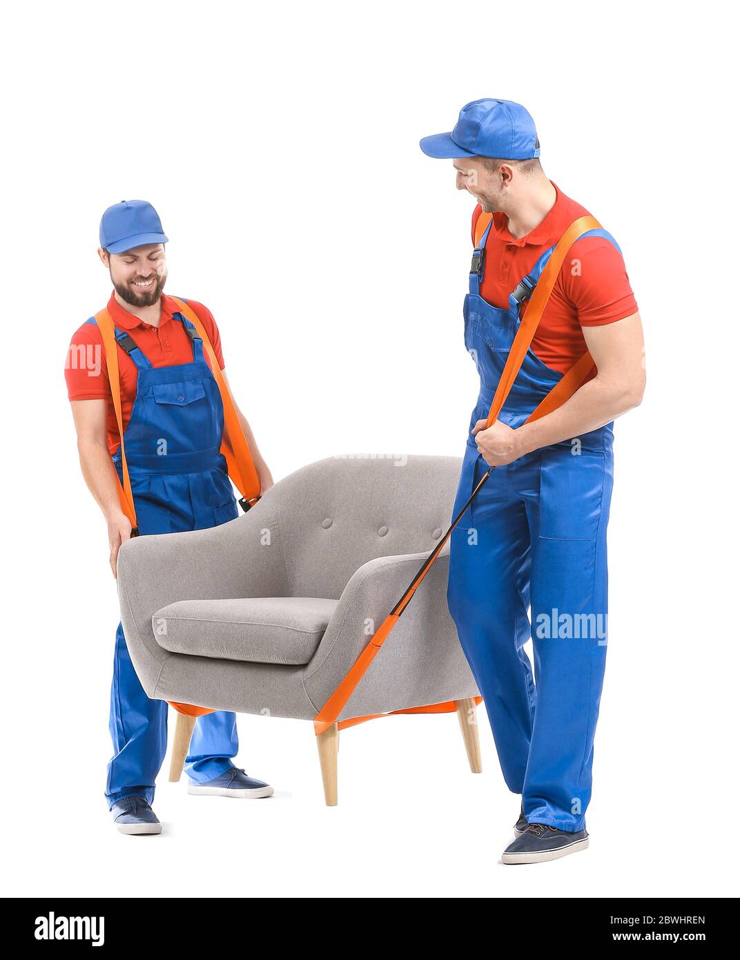 Loaders carrying furniture by using cargo belts on white background