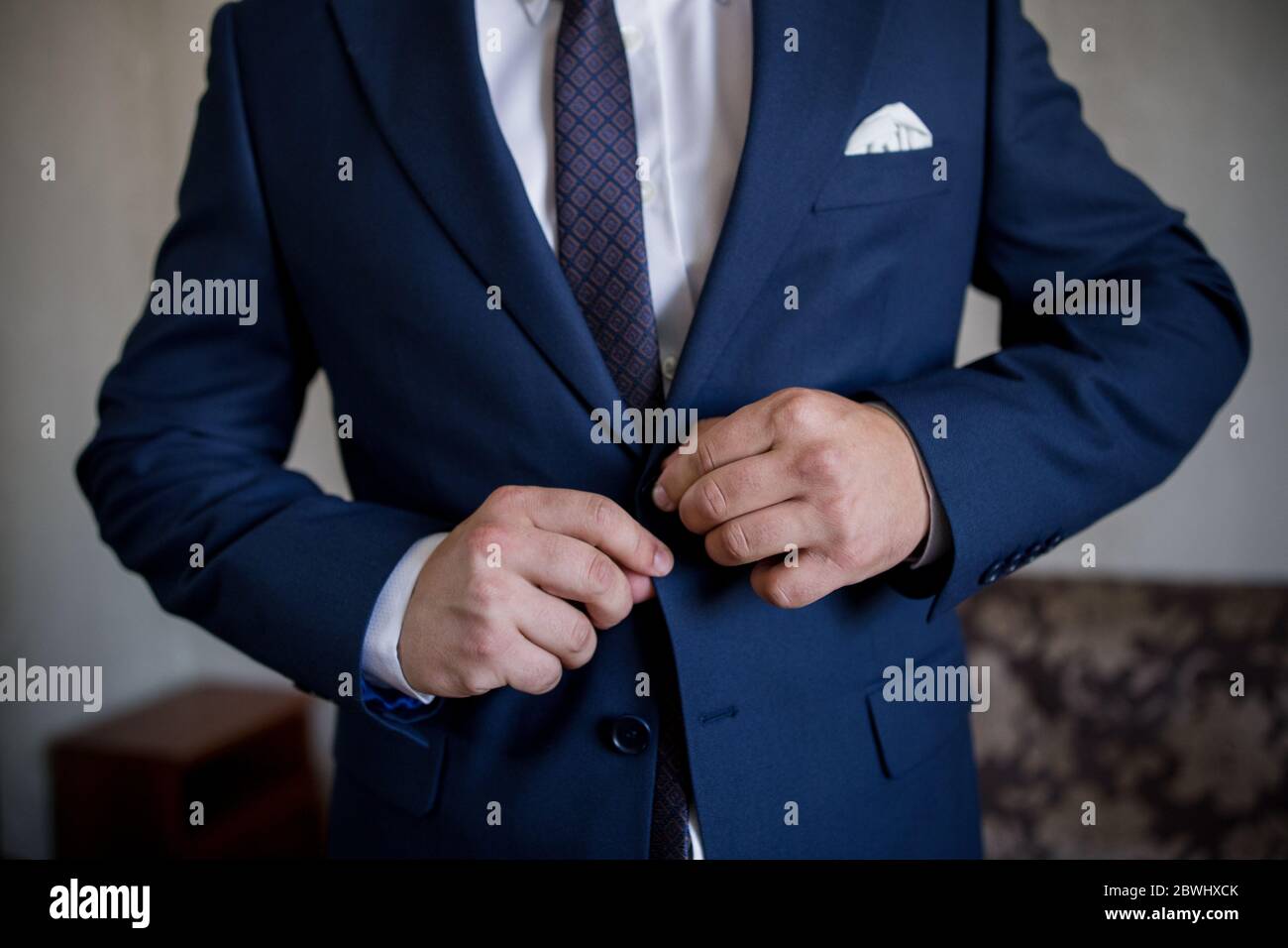 Man buttoning button on suit hi-res stock photography and images - Alamy